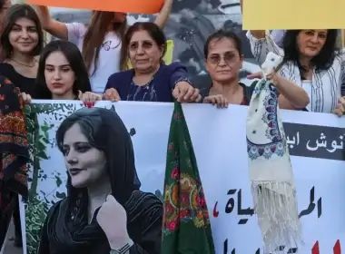 Women hold a picture of Mahsa Amini during a sit-in following her death, at Martyrs' Square in Beirut, Lebanon September 21, 2022 (photo credit: REUTERS/MOHAMED AZAKIR)