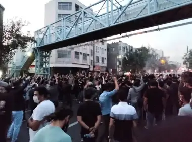 People attend a protest over the death of Mahsa Amini, a woman who died after being arrested by the Islamic republic's "morality police" in Tehran, Iran, Sept. 21, 2022. (West Asia News Agency via REUTERS)