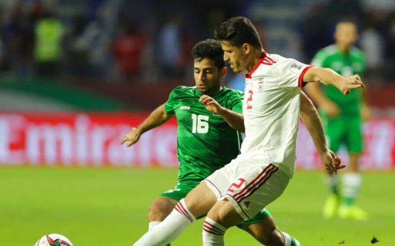 Voria Ghafouri, right, then an Iranian national soccer team player, fights for the ball during the AFC Asian Cup soccer match at the Al Maktoum Stadium in Dubai, United Arab Emirates, Jan. 16, 2019. AP