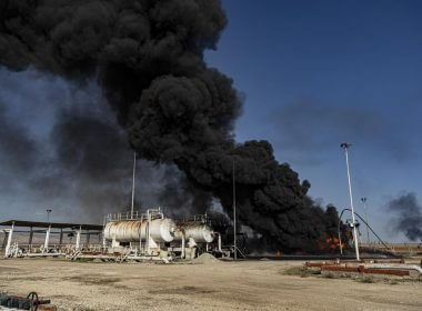 Smoke rises from an oil depot struck by the Turkish air force near the town of Qamishli, Syria, Wednesday, Nov. 23, 2022. (AP Photo/Baderkhan Ahmad)