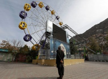 An Afghan man stands in an amusement park in Kabul, Afghanistan, November 9, 2022. REUTERS