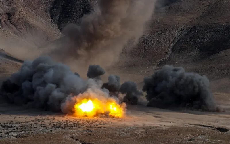 An explosion is seen during an Islamic Revolutionary Guard Corps (IRGC) ground forces military drill in the Aras area, East Azerbaijan province, Iran, October 19, 2022. (photo credit: IRGC/WANA (West Asia News Agency)/Handout via REUTERS)