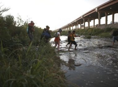 Venezuelan migrants walk across the Rio Bravo towards the United States border to surrender to the border patrol, from Ciudad Juarez, Mexico, Oct. 13, 2022. A surge in migration from Venezuela, Cuba and Nicaragua in September brought the number of illegal crossings to the highest level ever recorded in a fiscal year, according to U.S. Customs and Border Protection. Christian Chavez