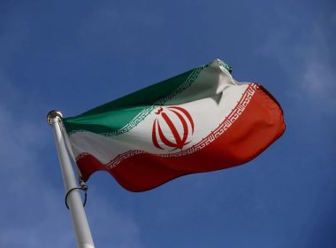 The Iranian flag waves in front of the International Atomic Energy Agency (IAEA) headquarters in Vienna, Austria, March 1, 2021. REUTERS