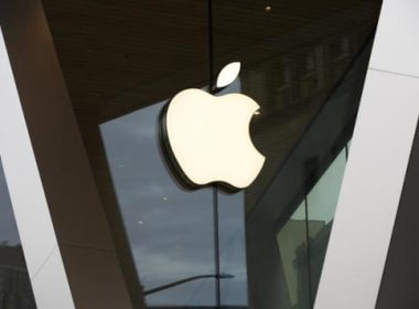 In this Saturday, March 14, 2020, file photo, an Apple logo adorns the facade of the downtown Brooklyn Apple store in New York. AP