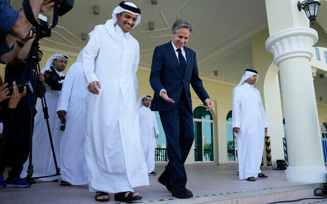 United States Secretary of State Antony Blinken, right, and Qatar Foreign Minister Mohammed Bin Adbulrahman Al Thani, left, walk to a media event at the Diplomatic Club, in November 22, 2022. (AP Photo/Ashley Landis)