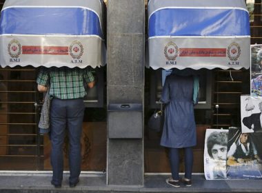 Iranians use ATMs of Bank Melli Iran in downtown Tehran, Iran, April 4, 2015. (AP Photo/Vahid Salemi, File)