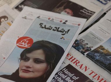 A newspaper with a cover picture of Mahsa Amini, a woman who died after being arrested by Iranian morality police is seen in Tehran, Iran, September 18, 2022. Majid Asgaripour/WANA (West Asia News Agency) via REUTERS