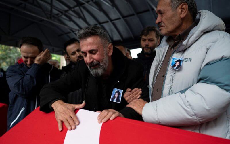 Nurettin Ucar (C) reacts during the funeral ceremony of his daughter Yagmur Ucar and ex-wife Arzu Ozsoy, who died the day before in the explosion of a bomb that killed six people in ?stanbul, on November 14, 2022. (Photo by YASIN AKGUL/AFP via Getty Images)