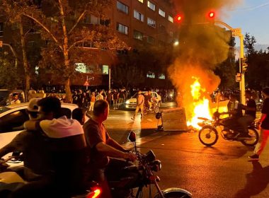 A police motorcycle burns during a protest over the death of Mahsa Amini in Tehran, Iran, Sept. 19, 2022. (West Asia News Agency via Reuters//File)