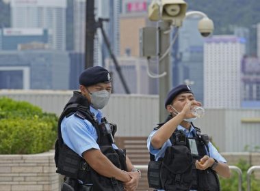 Police officers patrol outside the high speed train station for the Chinese president Xi Jinping’s visit to mark the 25th anniversary of Hong Kong handover to China, in Hong Kong, Thursday, June 30, 2022. (AP Photo/Kin Cheung)