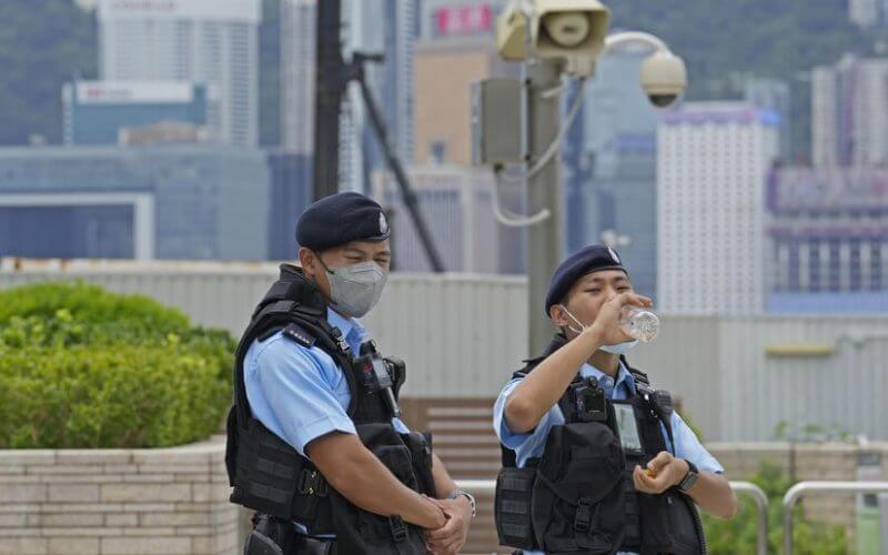 Police officers patrol outside the high speed train station for the Chinese president Xi Jinping’s visit to mark the 25th anniversary of Hong Kong handover to China, in Hong Kong, Thursday, June 30, 2022. (AP Photo/Kin Cheung)