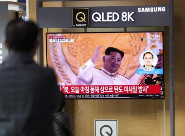 A TV screen showing a news program reporting about North Korea's missile launch with file footage of North Korean leader Kim Jong Un is seen at the Seoul Railway Station in Seoul, South Korea, Thursday, Nov. 3, 2022. AP
