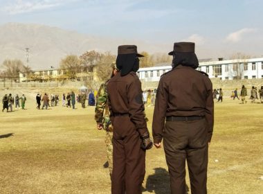 Taliban security personnel stand guard ahead of the public flogging of women and men at a football stadium in Charikar city of Parwan province, Dec. 8, 2022. AFP