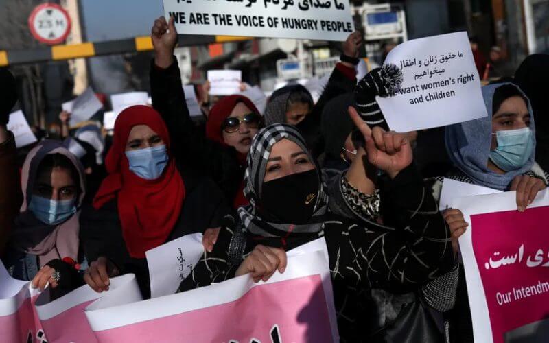Afghan women shout slogans during a rally to protest against what the protesters say is Taliban restrictions on women, in Kabul, Afghanistan, Dec. 28, 2021. (Reuters/Ali Khara)