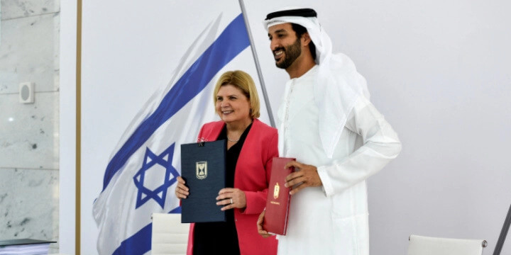Israel’s Minister of Economy and Industry Orna Barbivai and UAE Minister of Economy Abdulla bin Touq Al Marri present the Free Trade Agreement they signed, which is the first such agreement Israel has with an Arab county, in Dubai, United Arab Emirates May 31, 2022. Anuj Taylor Strap Studios-GPO/Handout via REUTERS