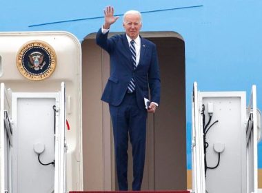 President Joe Biden waves as he boards Air Force One, Tuesday, Dec. 6, 2022, at Andrews Air Force Base, Md. Biden is traveling to Arizona to visit the building site for a new computer chip plant and speak about his economic agenda. (AP Photo/Luis M. Alvarez)