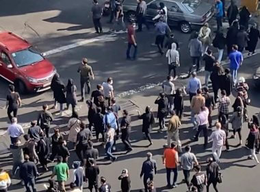 In this frame grab from video taken by an individual not employed by the Associated Press and obtained by the AP outside Iran shows people blocking an intersection during ongoing anti-government protests, in Tehran, Iran, Oct. 26, 2022. AP