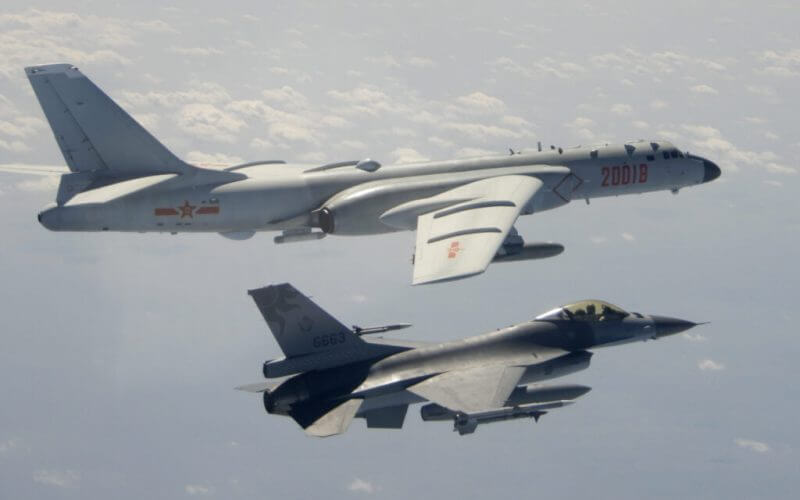 In this Feb. 10, 2020, file photo and released by the Republic of China (ROC) Ministry of National Defense, a Taiwanese Air Force F-16 in foreground flies on the flank of a Chinese People’s Liberation Army Air Force (PLAAF) H-6 bomber as it passes near Taiwan. (Republic of China (ROC) Ministry of National Defense via AP)