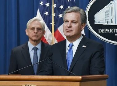 FBI Director Christopher Wray and Attorney General Merrick Garland at a news conference April 6, 2022, announcing a court-authorized disruption of Russian-controlled botnets (FBI photo)