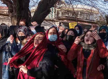 Afghan women chant slogans to protest against the ban on university education for women, in Kabul on December 22, 2022. (Photo by -/AFP via Getty Images)