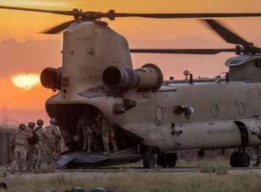U.S. Army soldiers board a CH-47 Chinook helicopter while departing a remote combat outpost known as RLZ on May 25, 2021 near the Turkish border in northeastern Syria. (John Moore/Getty Images).
