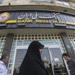 Pedestrians pass a Bank Melli Iran Inc. bank branch in Tehran, Iran, Aug. 22, 2015.Simon Dawson / Bloomberg via Getty Images