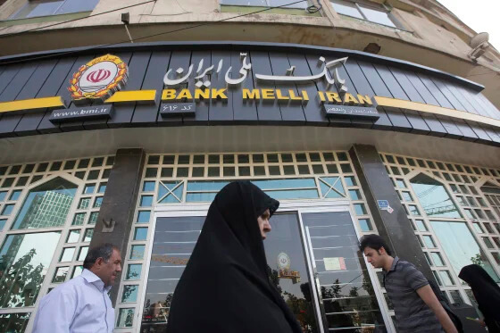 Pedestrians pass a Bank Melli Iran Inc. bank branch in Tehran, Iran, Aug. 22, 2015.Simon Dawson / Bloomberg via Getty Images