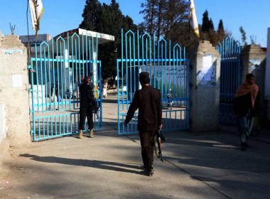 Taliban security personnel stand guard at the entrance gate of a university in Jalalabad. AFP