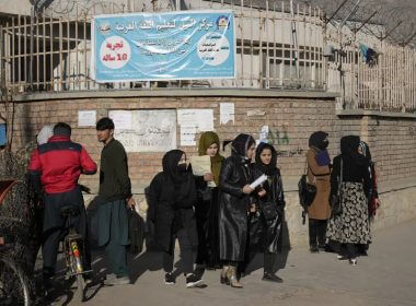 Afghan women students stand outside the Kabul University in Kabul, Afghanistan, Wednesday, Dec. 21, 2022. AP