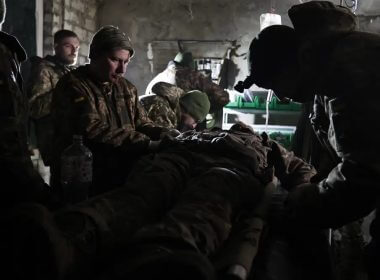 Ukrainian servicemen give the first aid to a soldier wounded in a battle with the Russian troops in their shelter in the Donetsk region, Ukraine, Thursday, Dec. 1, 2022.