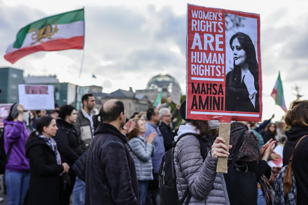Demonstrators march in solidarity with protesters in Iran on October 15, 2022 in Berlin, Germany. | Omer Messinger/Getty Images