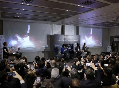 Officials of ispace Inc's HAKUTO-R mission look at live broadcasting of the launch of a SpaceX Falcon 9 rocket for ispace at Cape Canaveral Space Force Station, in Tokyo, Japan December 11, 2022. Mandatory credit Kyodo via REUTERS
