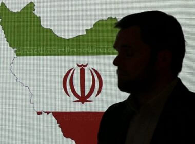 A cybersecurity expert stands in front of a map of Iran as he speaks to journalists about the techniques of Iranian hacking, on September 20, 2017, in Dubai, United Arab Emirates. (AP/Kamran Jebreili)