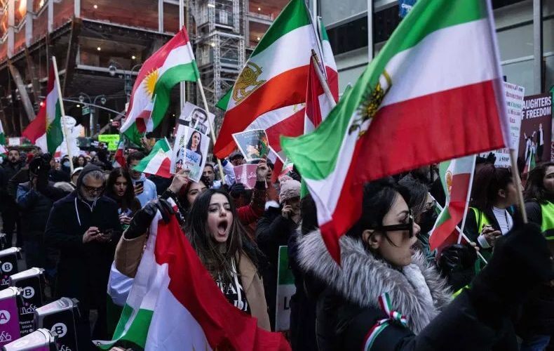 Protesters call on the United Nations to take action against the treatment of women in Iran, following the death of Mahsa Amini while in the custody of the morality police, during a demonstration in New York City on November 19, 2022. YUKI IWAMURA / AFP/GETTY IMAGES