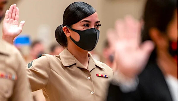 Marine Corps Cpl. Nicole Segarra takes the Oath of Allegiance during a naturalization ceremony at Camp Foster, Okinawa, Japan, July 1, 2021. (U.S. Marine Corps photo by Cpl. Terry Wong)
