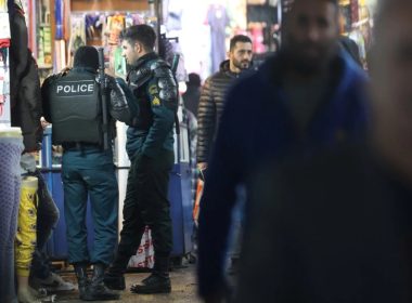 Police officers stand in Tehran Bazaar, in Tehran, Iran, Dec. 5, 2022. Several Iranian top-tier football players were reportedly briefly detained at a party on New Year's Eve where alcohol was served in violation of an Islamic ban. (Majid Asgaripour/WANA via Reuters)