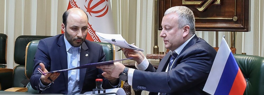 Iran and Russia Sign Deal to Link Banks. financialtribune.com