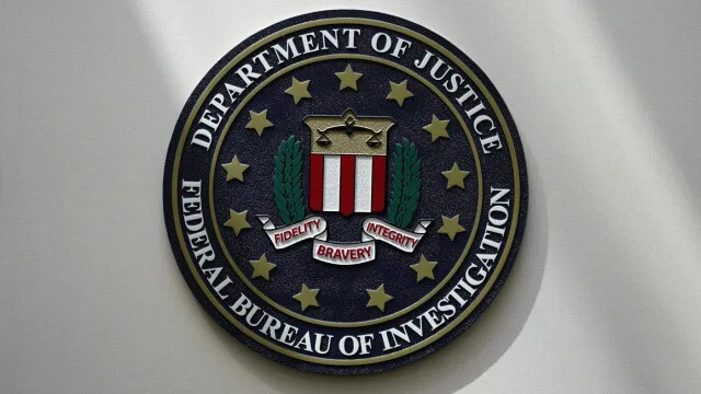 An FBI seal is seen on a wall on Aug. 10, 2022, in Omaha, Neb. (AP Photo/Charlie Neibergall, File)