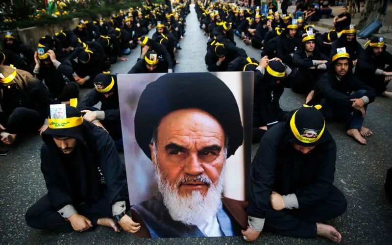 Lebanese Shiite supporters of the Iranian-backed Hezbollah group hold a portrait of Iran's supreme leader Ayatollah Ali Khamenei in Beirut, Lebanon. AP