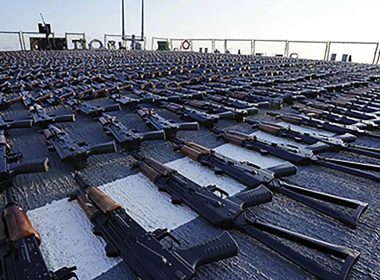 In this photo release by the U.S. Navy, hundreds of AK-47 assault rifles sit on the flight deck of the guided-missile destroyer USS The Sullivans during an inventory process, Jan. 7, 2023. (U.S. Navy photo via AP)