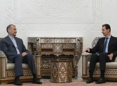 In this photo released on the official Facebook page of the Syrian Presidency, Syrian President Bashar Assad, right, meets with Iranian Foreign Minister Hossein Amirabdollahian in Damascus, Syria, Saturday, Jan. 14, 2023. (Syrian Presidency Facebook page via AP)