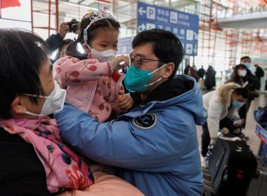 People embrace at the international arrivals gate at Beijing Capital International Airport after China lifted the coronavirus disease (COVID-19) quarantine requirement for inbound travellers in Beijing, China January 8, 2023. REUTERS