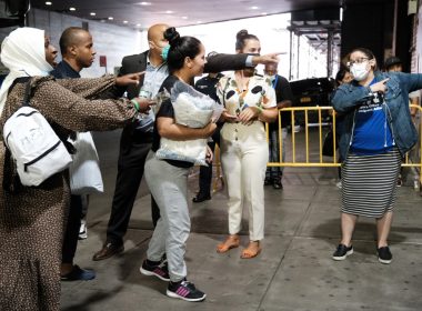 Migrants bussed from Texas by Gov. Greg Abbott arrive at Port Authority in New York on Aug. 25. “This is a crisis that’s unfolding and it could undermine our cities in a real way,” New York Mayor Eric Adams said. | Spencer Platt/Getty Images