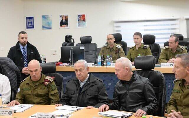 Prime Minister Benjamin Netanyahu (center) and Defense Minister Yoav Gallant (2nd right) during a visit to the military's Northern Command in Safed, January 10, 2023. (Amod Ben Gershom/GPO)