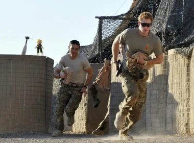 In this Nov. 3, 2012 file photo, Britain's Prince Harry, right, or just plain Captain Wales as he is known in the British Army, races out from the VHR (very high readiness) tent to scramble his Apache with fellow pilots, during his 12-hour shift at the British-controlled flight-line in Camp Bastion southern Afghanistan. (AP Photo/ John Stillwell, Pool, File)