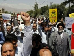 Iranians carry signs and chant anti-Israel slogans at a demonstration after Friday prayers in the capital Tehran on July 28, 2017 against Israeli security measures implemented at the Temple Mount compound in the Old City of Jerusalem. (AFP/Stringer)