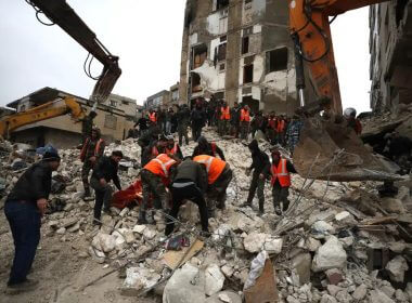 Civil defense workers and security forces search through the wreckage of collapsed buildings in Hama, Syria, Monday, Feb. 6, 2023. AP
