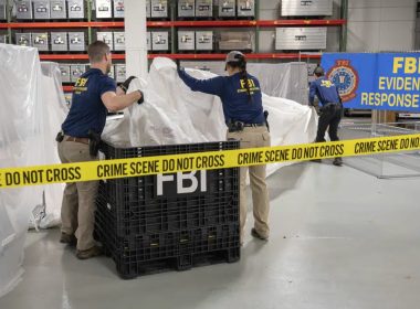 In this image provided by the FBI, FBI special agents assigned to the evidence response team process material recovered from the high altitude balloon recovered off the coast of South Carolina, Feb. 9, 2023, at the FBI laboratory in Quantico, Va. AP