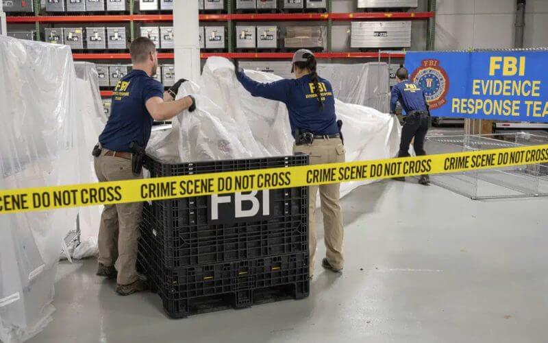 In this image provided by the FBI, FBI special agents assigned to the evidence response team process material recovered from the high altitude balloon recovered off the coast of South Carolina, Feb. 9, 2023, at the FBI laboratory in Quantico, Va. AP